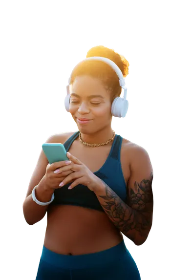 Woman wearing headphones using her phone during a workout