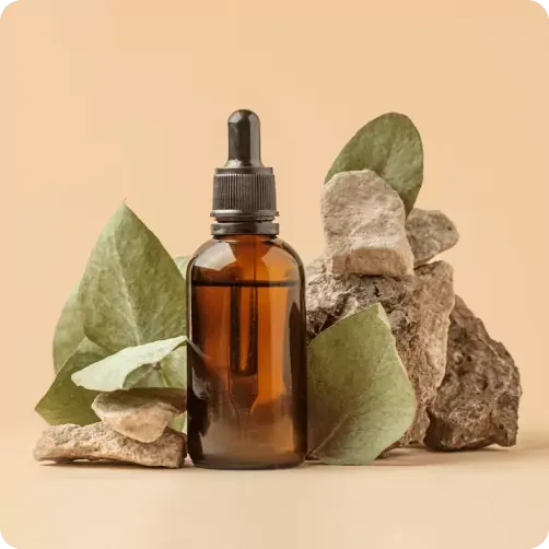 Homeopathic remedy bottle alongside dried herbs