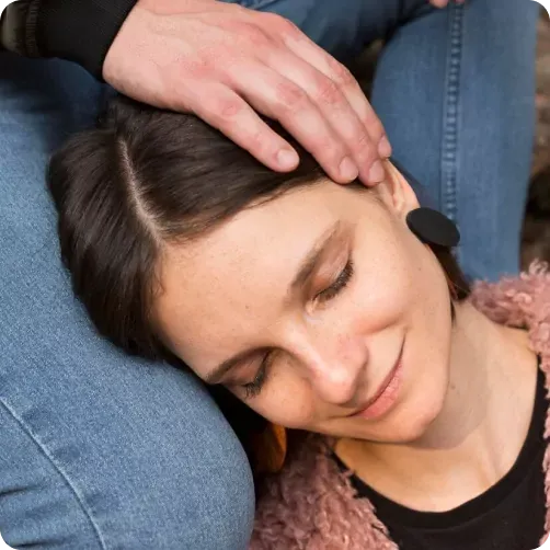 Person relaxing during a guided hypnotherapy session